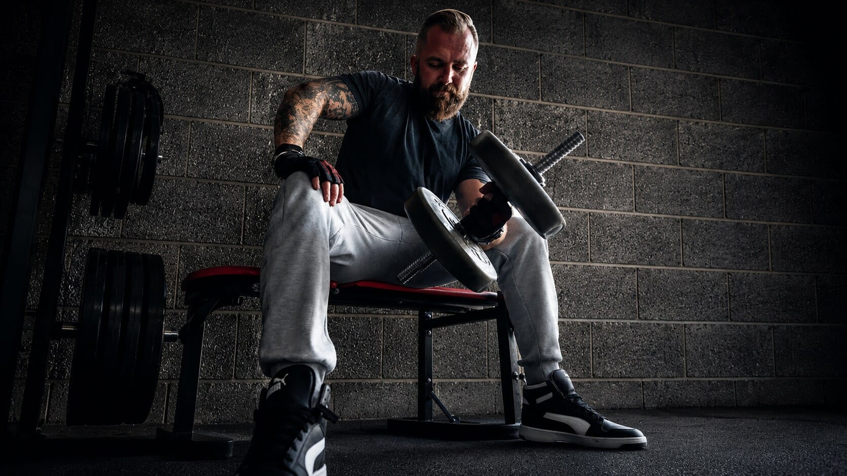 Wayne doing a dumbbell curl on the bench during a one-to-one session